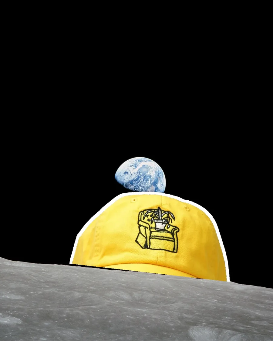 Earthrise photo with the yellow Plant on Chair cap rising over the moon